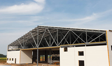 group of builders with tools indoors